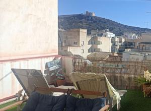 a balcony with a view of a city at Maison de charme 2 terrasses, en ville, mer, port. in Águilas