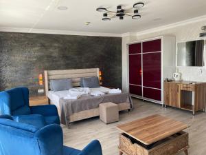 a bedroom with a bed and a couch and a table at Galata Moon Hotel in Istanbul +49 photos