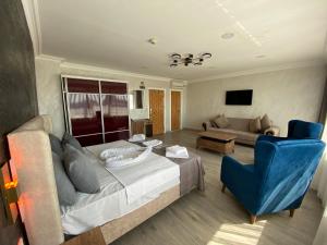 a living room with a bed and a couch at Galata Moon Hotel in Istanbul