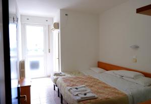 Postel nebo postele na pokoji v ubytování Albergo ristorante Elena