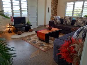 a living room with a couch and a coffee table at Samia House in Malindi