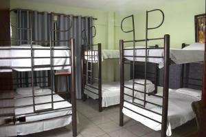 a group of bunk beds in a room at Hostal Ibiza in Santa Cruz de la Sierra