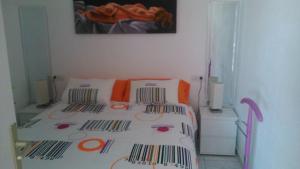 Postel nebo postele na pokoji v ubytování LA MAYOR BUNGAMERICA AU BORD DE L'OCEAN RESIDENTIEL