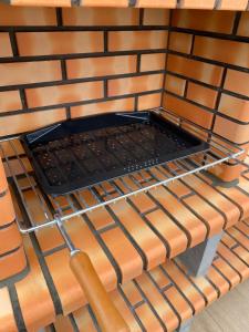 a room with a metal rack on a wall at Villa San Miguel in Cudón