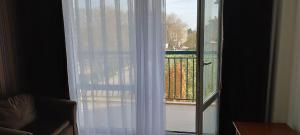 a sliding glass door with a view of a balcony at Hotel Yo in St. St. Constantine and Helena