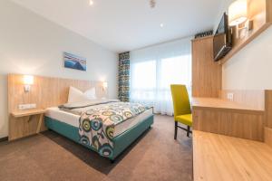 Postel nebo postele na pokoji v ubytování Ammi Hotel Garni
