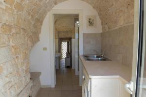 Kuchyň nebo kuchyňský kout v ubytování Trulli Lisanna - Luxury Trulli With Private Pool