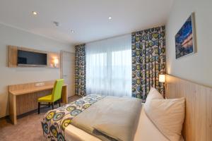 Postel nebo postele na pokoji v ubytování Ammi Hotel Garni