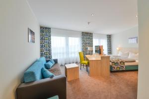Postel nebo postele na pokoji v ubytování Ammi Hotel Garni