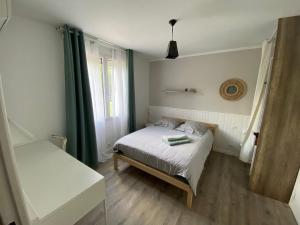 Postel nebo postele na pokoji v ubytování VILLA BOSC VIEL