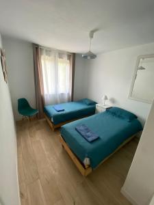 Postel nebo postele na pokoji v ubytování VILLA BOSC VIEL