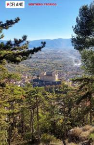 a view of a city from a hill with trees at Casa Nanna Edo in Celano