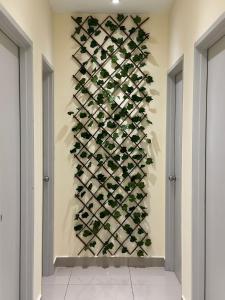 a wall of wine bottles in a wine cellar at Meridin Bayvue 3 Bedroom in Kampong Kuala Masai