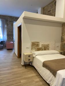 Postel nebo postele na pokoji v ubytování Reginita Apartamentos