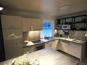Kuchyň nebo kuchyňský kout v ubytování Ferienhaus am See