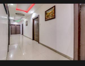 a hallway of a building with a door and a wall at Hotel Neelkanth , Bhopal in Bhopal