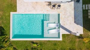 an overhead view of a swimming pool in a yard at Villa Cancu, 2 bd, 2.5 bath, wi-fi, pool, Parking in Cabarete