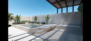a hot tub in a patio with sidx sidx sidx at ARC suites in Ios Chora