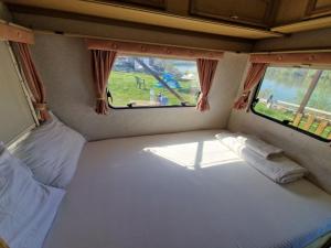 Postel nebo postele na pokoji v ubytování Green camp & Sports Pri Popa