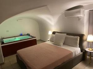 A bed or beds in a room at Acquadellarte B&B