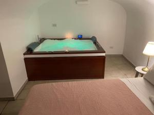 A bed or beds in a room at Acquadellarte B&B