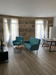 Posezení v ubytování Reginita Apartamentos