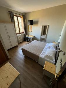 Postel nebo postele na pokoji v ubytování AgriHotel Villa Ambra