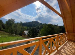 a view from the balcony of a log cabin at Babiogórskie klimaty in Zawoja