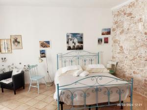 Ένα ή περισσότερα κρεβάτια σε δωμάτιο στο Dimora delle Badesse