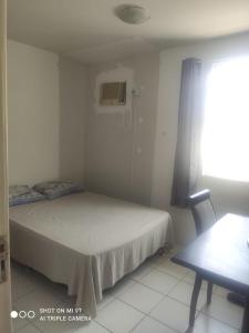 Katil atau katil-katil dalam bilik di Quartos na praia da jatiúca