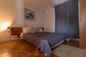 Ένα ή περισσότερα κρεβάτια σε δωμάτιο στο Wohnung in Privlaka mit Terrasse, Garten und Grill