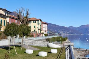 a view of a city with a lake and buildings at Belvedere 237A Lakeview Luxury Apartment in Ghiffa