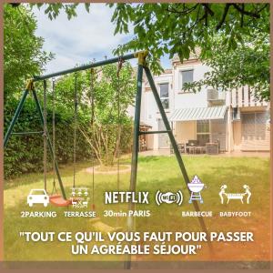a swing set with a sign in a yard at LE GARDEN -MAISON-2Parking-Jardin-Terrasse-Babyfoot-wifi in Cergy
