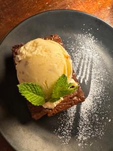 a piece of food with ice cream on a plate at Nativo in Santa Catalina