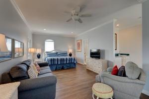 a living room with two couches and a bed at Martinique Close To Beach Pet Friendly in Destin