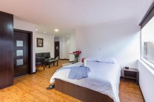 Postel nebo postele na pokoji v ubytování Gaviota Apartments & Suites