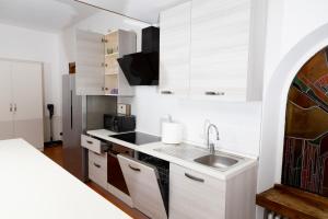 Kuchyň nebo kuchyňský kout v ubytování Verona Relax & Stay ROOMS