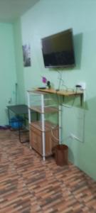 a desk with a computer on it in a room at Mansfield Inn Ocho Rios in Ocho Rios