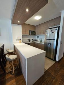 Køkken eller tekøkken på Departamento Parque Pinares Pucón Playa Privada