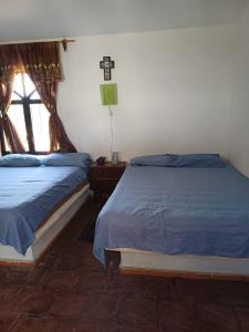 Postel nebo postele na pokoji v ubytování Rincón San Jerónimo