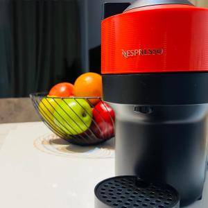 aresso machine sitting on a table with a bowl of fruit at Glamorous, Renovated 3-Bedroom Apt in Nicosia in Nicosia