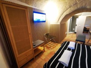 TV a/nebo společenská místnost v ubytování Albachiara Room + 4 fotografie