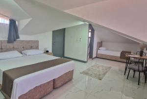 A bed or beds in a room at @Home Dalyan