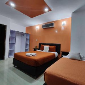 Postel nebo postele na pokoji v ubytování HOTEL MILLA SUITES MERIDA + 27 fotografií
