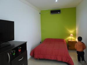 Säng eller sängar i ett rum på Nueva Era Apart
