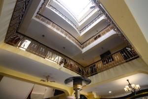 a coffered ceiling with a skylight in a restaurant at TerraMistica Puno Centro in Puno