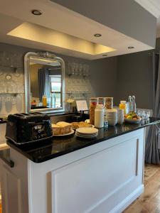 a kitchen with a counter with food on it at Lisalway Country Lodge in Castlerea