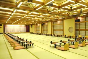 an empty banquet hall with tables and chairs at Wakatake in Tagami