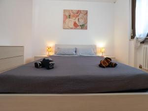 Un pat sau paturi într-o cameră la Appartamento in Centro a Udine