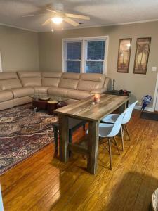 a living room with a table and a couch at Location, location, location! in Ocean Isle Beach